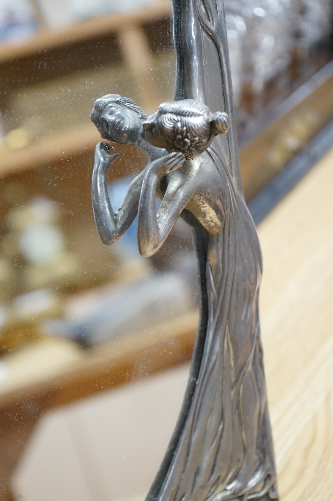 A WMF style metal mounted and engraved glass claret jug and a later figural easel mirror, tallest mirror 36cm.